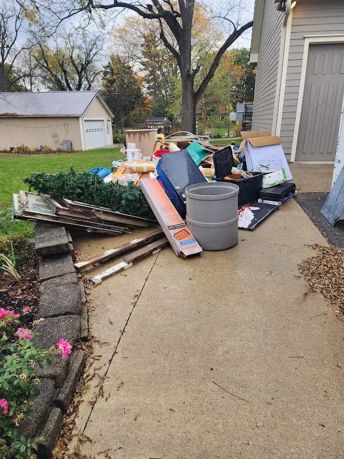 Dumpster being loaded with debris for 30 Yard Dumpster Rental in Rock Hill